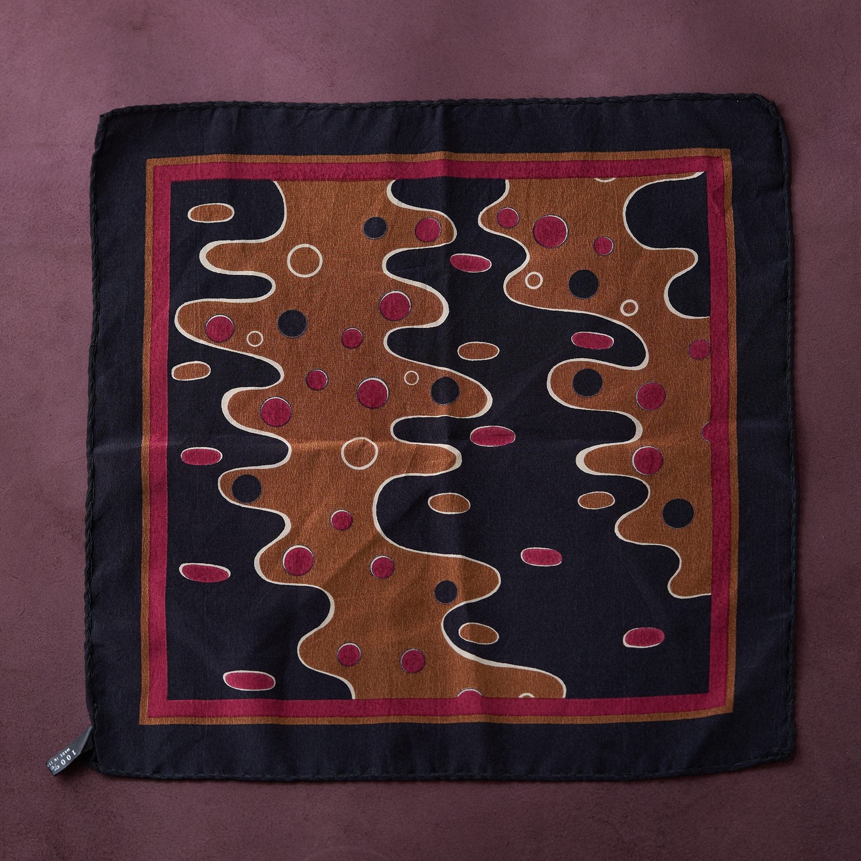 Decorative pillow with abstract design on a purple background