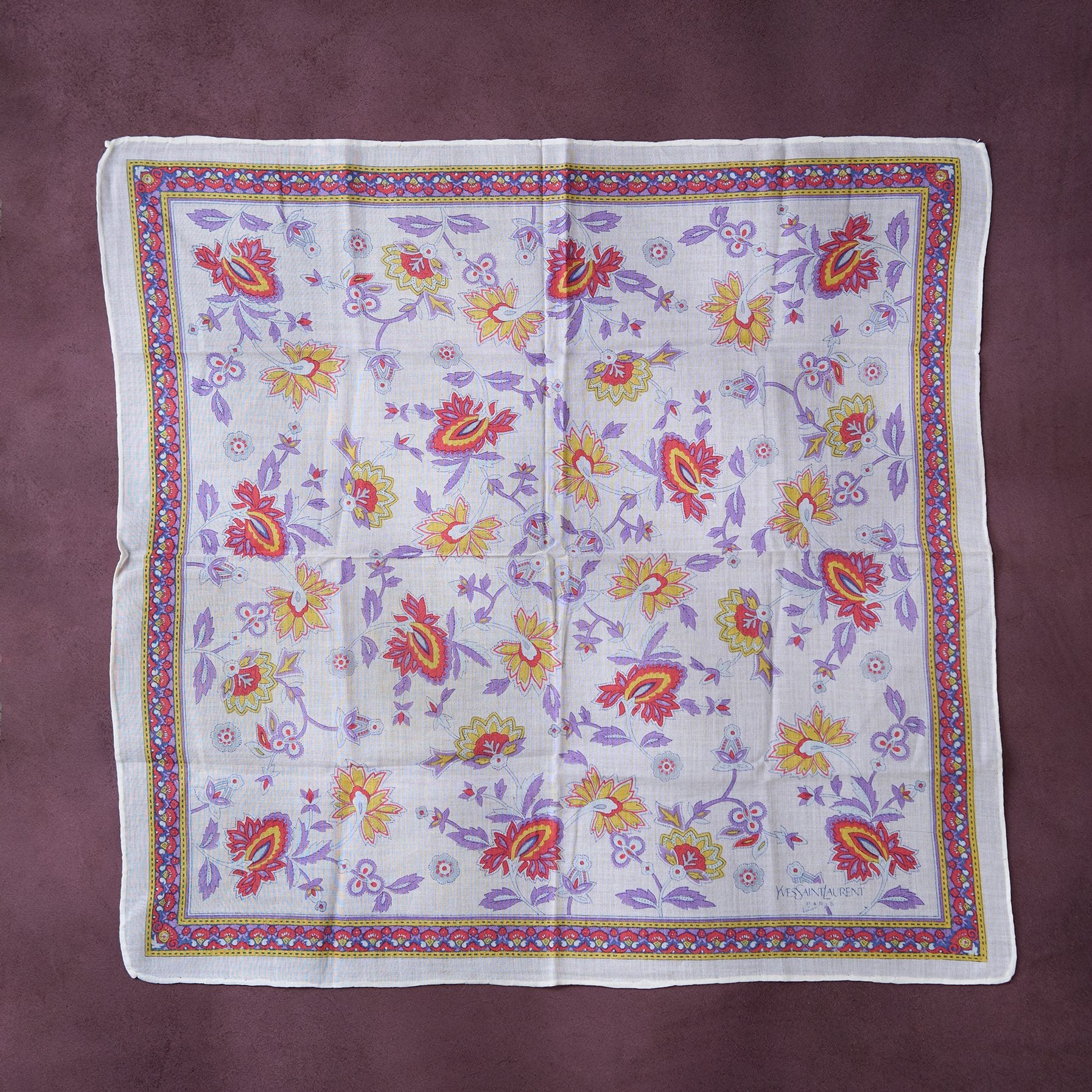 Floral patterned fabric on a purple background