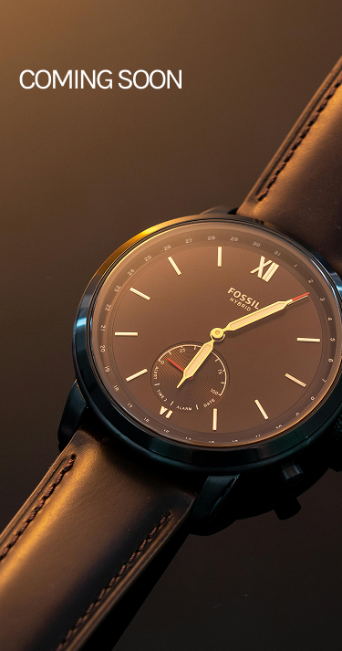 Fossil watch with brown leather strap and brown dial.
